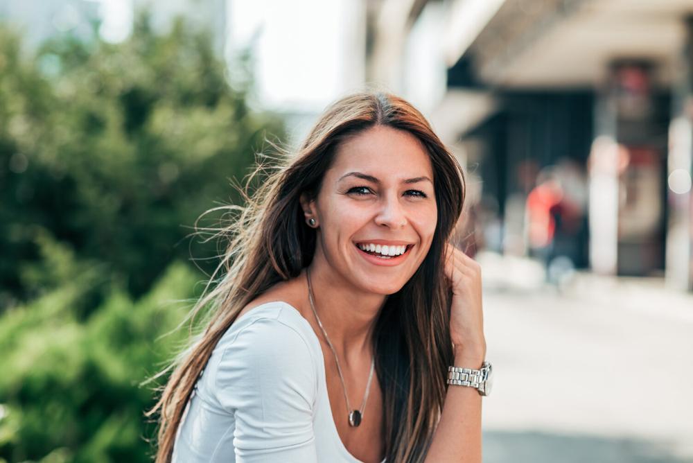 woman smiling after getting a crown