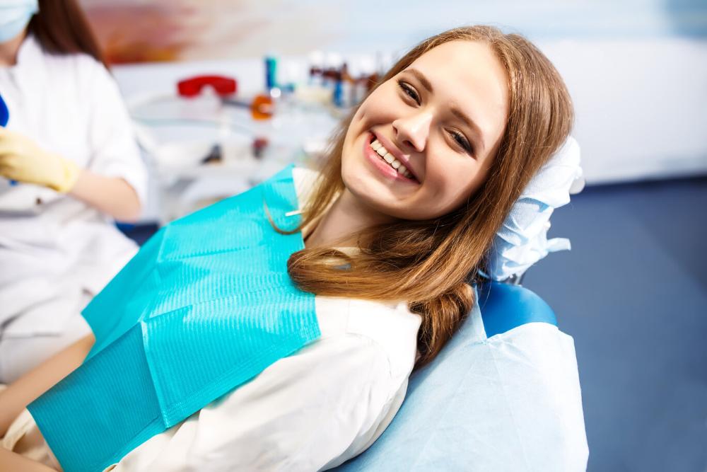 Woman smiling in dental chair in midtown manhattan