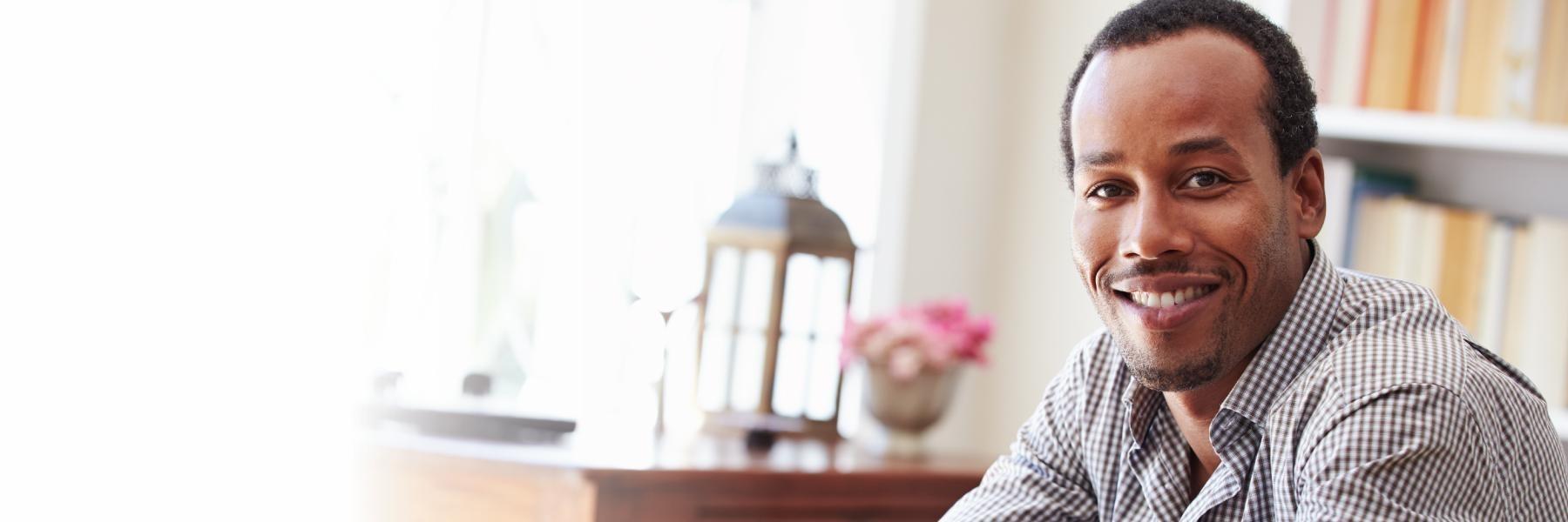 man with dental implants smiling in new york ny