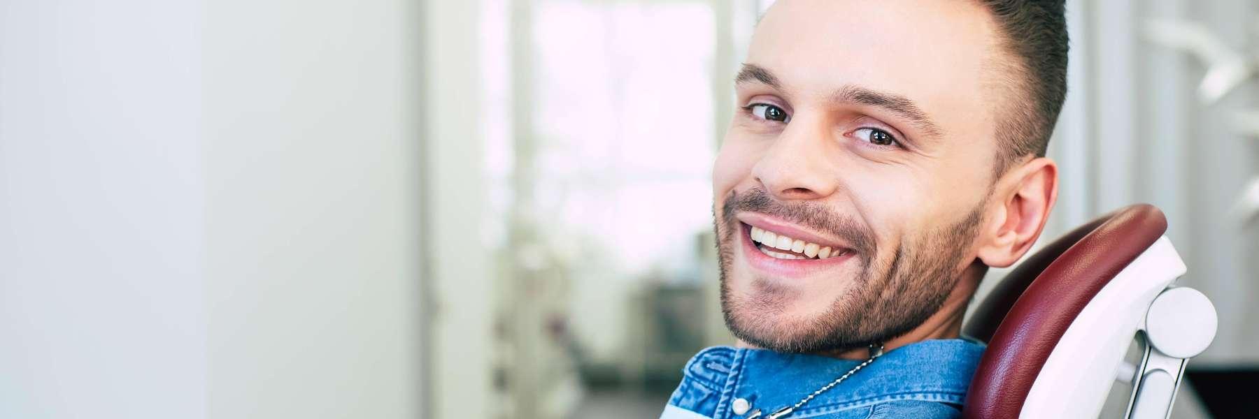 man after getting dental crown fixed