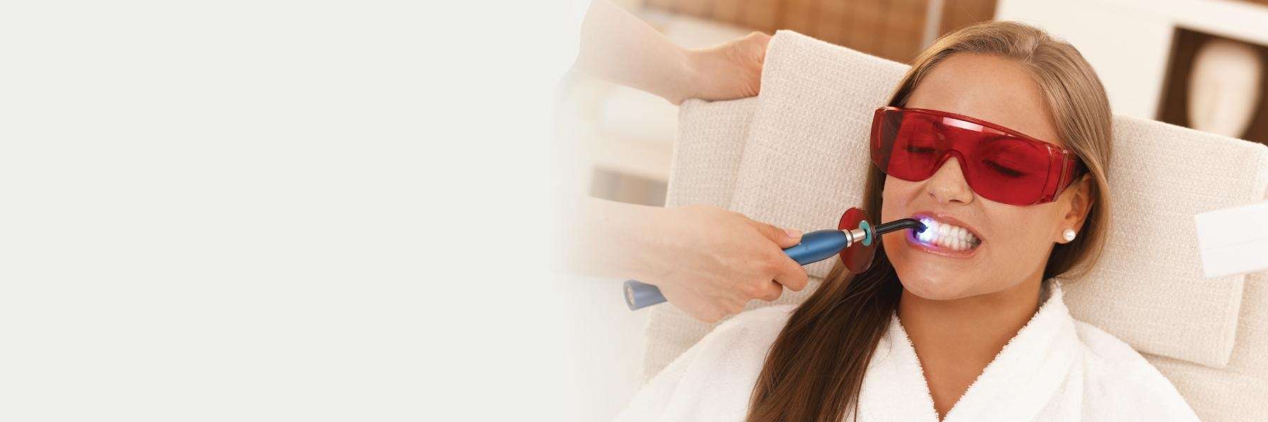 woman receiving teeth whitening services