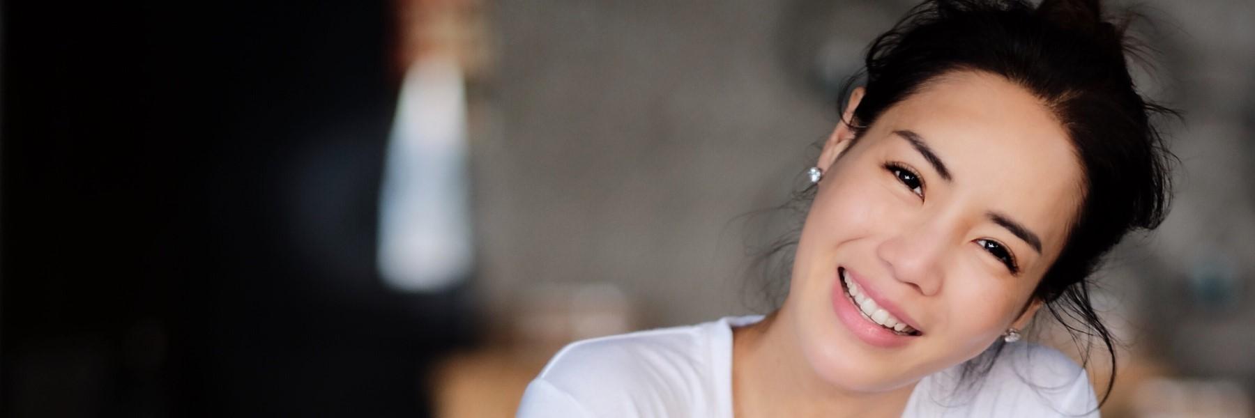 girl smiling after laser teeth whitening in midtown nyc