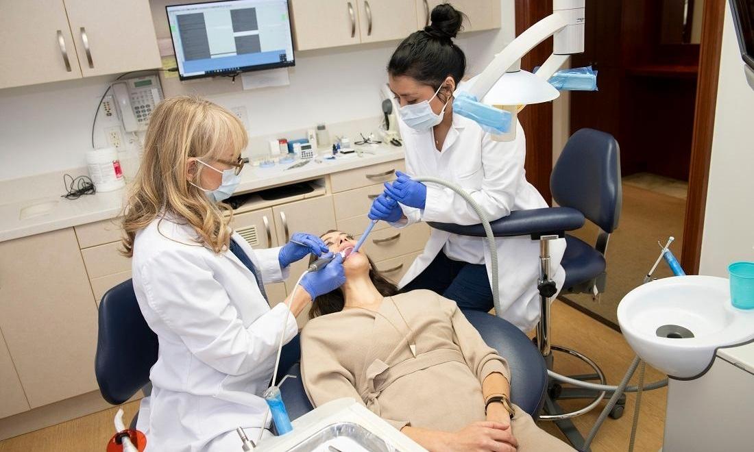 Patient getting dental exam at dentist near me 10022