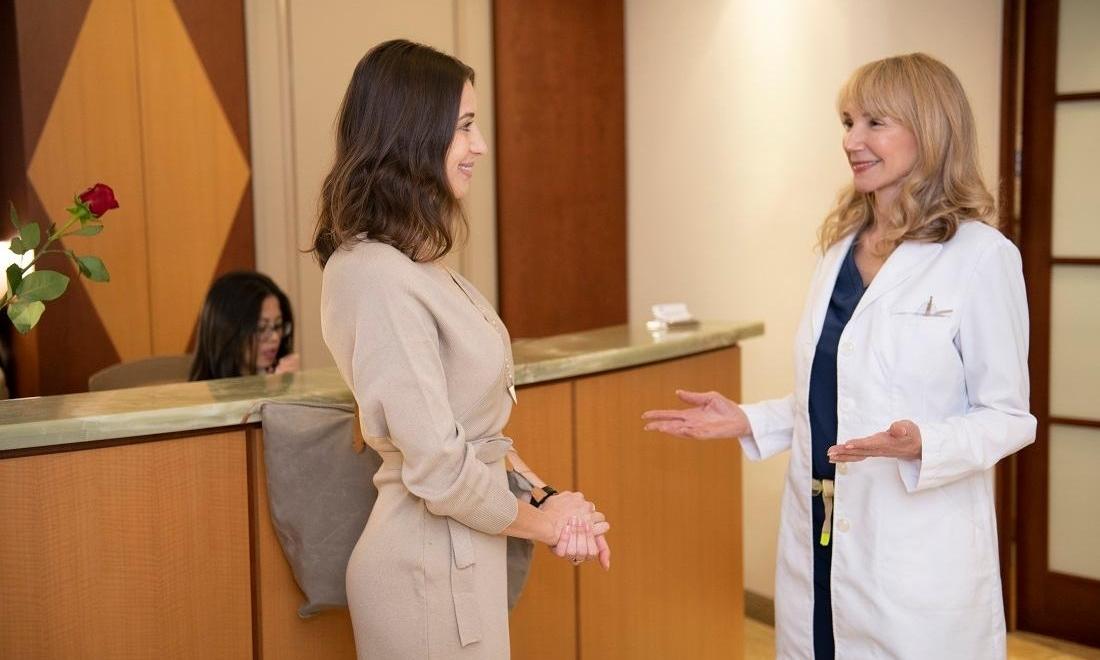 Dr Helma Philips DDS talking to patient in Midtown NYC